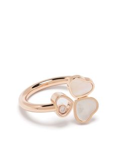 18kt rose gold 18kt rose gold Happy Hearts Wings diamond and mother-of-pearl ring from Chopard featuring signature dancing diamond, heart charm and mother-of-pearl. POSITIVELY CONSCIOUS: This Chopard product is made of 100% Ethical Gold, acquired from responsible sources and verified against international best practice for environmental and social standards.. | Chopard 18kt rose gold Happy Hearts Wings diamond and mother-of-pearl ring Chopard Ring, Social Standards, Chopard Jewelry, Dancing Diamond, The Bling Ring, Expensive Jewelry Luxury, Heart With Wings, Expensive Jewelry, Happy Heart