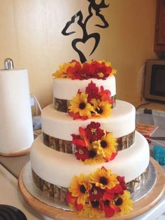 there is a wedding cake with flowers on it