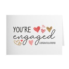 congratulations card with hearts and the words, you're engaged congratulationss on it