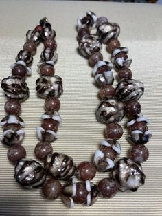 Unusual mix of difference beads brown and white hook clasp 18 inches long Brown Multi-strand Beaded Necklaces, Elegant Brown Multi-strand Beads, Unique Brown Multi-strand Necklace, Brown Multi-strand Necklace With Polished Beads, Brown Beaded Necklace, Vintage Brown Multi-strand Beaded Necklace, Hook Clasp, Beaded Necklaces, Necklace Etsy