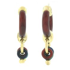 "Here we have a fabulous pair of estate earrings very well crafted in solid 18k yellow gold in a unique drop dangle style and covered neatly with lovely enamel throughout. The large hoop at the top is covered with a dark red color enamel and gives these earrings a nice bold look on the ear. Gently dangling below from a gold hoop are three smaller links, each covered with a different color enamel that includes, navy blue, green, and red in which matches the large hoop above. The enamel on each ea Yellow Gold Enamel Hoop Earrings For Pierced Ears, Yellow Gold Small Hoop Earrings With Enamel, Yellow Gold Enamel Dangle Earrings, Yellow Gold Small Hoop Enamel Earrings, Yellow Gold Enamel Small Hoop Earrings, Small Hoop Yellow Gold Enamel Earrings, Yellow Gold Enamel Hoop Earrings, Traditional Red Enamel Earrings, Yellow Gold Enamel Clip-on Earrings