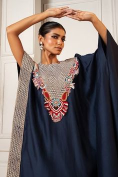 Navy blue silk asymmetric kaftan with floral pearls, beads, thread work and zardosi embroidered yoke. Paired with coordinating solid straight pant. - Aza Fashions Embroidered Straight Kurta Kaftan For Party, Traditional Silk Kaftan For Parties, Party Embroidered Straight Kurta Kaftan, Traditional Embellished Evening Kurta, Traditional Silk Party Kaftan, Silk Kurta Hand Embellished For Reception, Silk Hand Embellished Kurta For Reception, Anarkali Kaftan With Mirror Work For Parties, Anarkali Mirror Work Party Kaftan