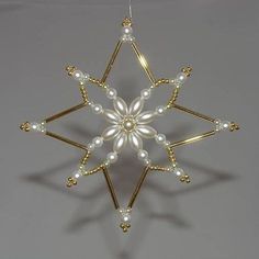 an ornament made out of pearls and gold