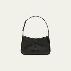 Saint Laurent "Le 5 À 7"  monogram hobo bag in patent calf leather. Shoulder bag that tucks under the arm for a sleek, retro-chic look. Adjustable shoulder strap, 8" drop Center flap top with YSL logo, tab closure. Black-tone hardware. Interior, zip pocket. Approx. 9"H x 6.3"W x 2.6"D. Made in Italy Classic Patent Leather Bag With Glossy Finish, Classic Patent Leather Evening Bags, Classic Evening Bags In Patent Leather, Glossy Finish Satchel Shoulder Bag, Classic Glossy Business Shoulder Bag, Designer Patent Leather Shoulder Bag For Formal Events, Glossy Finish Top Handle Shoulder Bag, Designer Patent Leather Shoulder Bag For Formal Occasions, Classic Business Shoulder Bag With Glossy Finish