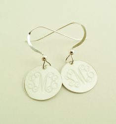 "Dangle Earrings in Sterling Silver Perfect present for Valentines Day or any occasion. Sterling silver dangle earrings will be monogrammed engraved permanently. Top quality 925 sterling silver. Comes gift boxed. Please state engraving information in notes to seller at checkout. Shown with Interlocking monogram, single initials also look very good on these. You can see font choices in extra photos. For Monograms please provide initials in first, last, middle order. Earrings- 1/2\" Sterling Silve Classic Sterling Silver Initials Jewelry, Classic Sterling Silver Jewelry With Initials, Sterling Silver Round Disc Jewelry With Matching Earrings, Sterling Silver Jewelry With Matching Earrings And Round Disc, Sterling Silver Jewelry With Matching Earrings, Round Disc Shape, Engraved Sterling Silver Dangle Jewelry, Classic Personalized Round Earrings, Personalized Classic Earrings For Anniversary, Classic Personalized Earrings For Anniversary