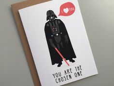 a card with a darth vader saying you are the chosen one on it