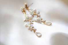 Our Lolita Gold Freshwater Pearl Earrings will make your wedding day even more special. Carefully crafted with freshwater pearls and white opal Austrian crystals in an intricate floral design, these earrings will make you feel like an elegant and beautiful bride. Their timeless sophistication is the perfect finishing touch for your bridal look. - Handcrafted with genuine Austrian crystals- Created in my studio in PA- White opal crystals- Freshwater pearls- Polymer clay flowers- Yellow gold finis Flowers Yellow, Freshwater Pearl Earrings, Freshwater Pearls Earrings, Polymer Clay Flowers, Bridal Look, Clay Flowers, Opal Crystal, Gold Floral, White Opal