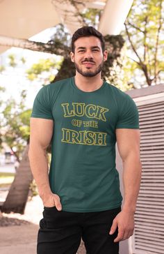 Men's Luck Of The Irish Shirt St. Patrick's Day TShirts Typography Tee Irish Gift Minimal Cool St Pattys Shirt Men Women Unisex Tee Gift Idea Show off your Irish pride in this tee for St. Patrick's day with a minimal logo that features a bold typography. It simply reads 'Luck Of The Irish' in a gold color. Show of your luck in a shirt printed just for you. A great shirt to wear throughout the year, but especially on St. Patrick's day! We only print on soft ring spun cotton. Includes our signatur St. Patrick's Day Graphic Print Crew Neck Top, Funny Cotton T-shirt With Lettering, Green Cotton T-shirt With Lettering, Green Graphic Tee With Lettering, St. Patrick's Day Crew Neck T-shirt, Green Crew Neck T-shirt With Lettering, St. Patrick's Day Cotton T-shirt With Letter Print, St. Patrick's Day Cotton Crew Neck Tops, Father's Day Fan Apparel Short Sleeve Tops