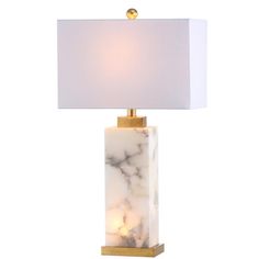 a marble lamp with a white shade on it