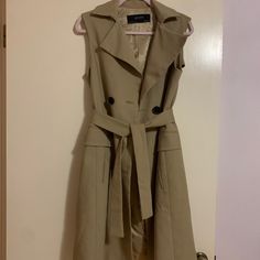 Zara Basic Collection Sleeveless Trench Coat Taupe/ Nude / Tan With Black Buttons Perfect Fall Staple! Size: X Small Like New Condition, Only Worn Once! Brown Spring Workwear Vest, Brown Spring Vest For Workwear, Brown Vest For Workwear In Spring, Elegant Sleeveless Spring Outerwear, Khaki Sleeveless Outerwear For Spring, Sleeveless Khaki Outerwear For Spring, Beige Sleeveless Outerwear For Work, Khaki Workwear Vest Outerwear, Khaki Workwear Vest