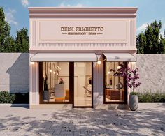 the front entrance to a store called deisi frighetto with flowers in vases