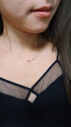 "A simple and minimal piece, this tiny bead necklace is sure to become an everyday staple for layering. 3 little satin finish round beads slide freely along delicate chain MATERIALS tarnish resistant rhodium silver filled or gold filled charm & chain DIMENSIONS 40.6cm (16\") plus 2\" extender chain, each bead measures 4mm (5/32\") diameter ◊ Matching sphere jewelry: https://www.etsy.com/shop/kindlingandco/search?search_query=ball ◊ More dainty charm necklaces: https://www.etsy.com/shop/kindl Minimalist Jewelry With Satellite Chain, Minimalist Everyday Beaded Necklaces, Minimalist Sterling Silver Necklace With Tiny Beads, Dainty Sterling Silver Station Necklace, Minimalist Sterling Silver Station Necklace, Silver Minimalist Beaded Necklace With Delicate Chain, Minimalist Beaded Necklaces, Sphere Jewelry, Tiny Bead Necklace