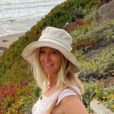 "A handmade sun hat for sunny beach days and summer fun.  This linen sun hat for women has a nice wide brim to protect your whole face and even your neck and chest. A drawstring around the head keeps the hat fitting snug.  Easy to bring along in your bag, folds up easy.   This hat is made from a medium weight homespun linen and cotton blend fabric in a neutral beige color.  Inside liner is white cotton.  I used a stiff interfacing for brim to keep it's shape. Brim measures 4.5\" Crown depth is 3 Natural Bucket Hat For Outdoor Summer Activities, Summer Outdoor Bucket Hat In Natural Color, Summer Outdoor Natural Bucket Hat, Natural Bucket Hat For Beach Season, Natural Bucket Hat With Curved Brim For Outdoor, Summer Brimmed Bucket Hat For Travel, Beige Sun Hat For Outdoor, Beige Bucket Hat With Uv Protection For Beach Season, Natural Curved Brim Bucket Hat For Outdoor