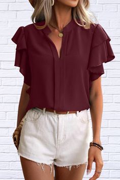 Get ready to make a statement with our Ruffled Notched Short Sleeve Blouse. This blouse is the epitome of feminine chic with its charming ruffled details and classic notched neckline. Perfect for adding a touch of elegance and style to any outfit. Elevate your wardrobe with this must-have piece! Shipping 7 To 14 Days Features: Ruffled Sheer: Opaque Stretch: No stretch Material composition: 100% polyester Care instructions: Machine wash cold. Tumble dry low. Imported Product measurements:S:Bust 3 Elegant Non-stretch Solid Color Blouse, Non-stretch Solid Color Office Blouse, Elegant V-neck Ruffled Blouse, Formal V-neck Blouse With Ruffles, Chic Solid Color Split Neck Tops, Casual Ruffled Split Neck Blouse, Chic Solid Color Split Neck Blouse, Chic Solid Split Neck Blouse, Elegant Top With Split Neck In Solid Color