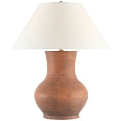 a lamp that is on top of a table with a white lampshade over it