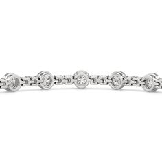 A testament to our vision of harmonizing luxury and simplicity. This tennis bracelet features a continuous line of round diamonds laid out in a pattern of one alternating bezel-set round diamond and a duo of claw prong-set round diamonds. The bracelet's understated design showcases the unparalleled fire and brilliance of the most popular diamond shape. Modern Round Tennis Bracelet With Prong Setting, Modern Round Bracelet With Bezel Setting, Modern Round Bracelets With Bezel Setting, Modern White Gold Diamond Bracelet With Bezel Setting, White Gold Diamond Bracelet With Bezel Setting, Silver Diamond Channel Set Bracelet, Silver Diamond Bracelet With Channel Set, Timeless Round Diamond Bracelet Channel Set, Timeless Round Diamond Bracelet With Channel Set