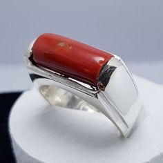 "Red Coral /Moonga 4.00-11.00 Ct. Stone 92.5 Sterling Silver Ring For Men & Women. This ring is suitable for Men & Women having ring sizes between 4.25 to 12.00 as per US ring standards. Size of this ring is easily by hand. Fine quality Red Coral is used to give best results for your astrological needs. Stone will be neat and clean without blemishes. Gemstone is left open from the back side. Gemstone certified by a Well reputed laboratory. This fashionable flat Rings band is dainty and e Red Rectangular Jewelry With Polished Finish, Modern Hallmarked Red Rings, Red Rectangular Ring With Polished Finish, Red Rectangular Rings With Polished Finish, Modern Red Ring Jewelry, Modern Red Gemstone Ring, Adjustable Formal Ruby Gemstone Ring, Rectangular Red Rings With Polished Finish, Modern Red Jewelry For Anniversary