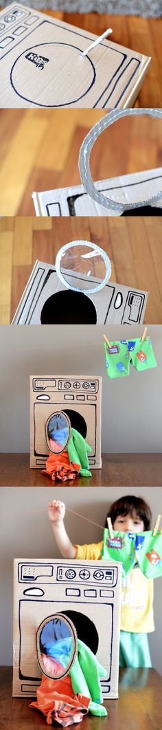 the child is playing with his toys on the wooden floor in front of some cardboard boxes