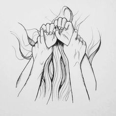 two hands holding each other above their head with the word love written on it in black ink