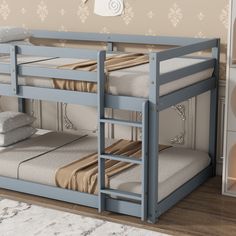 a blue bunk bed sitting next to a white dresser