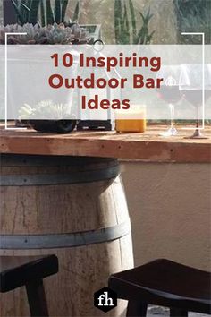 an outdoor bar with wine glasses on it