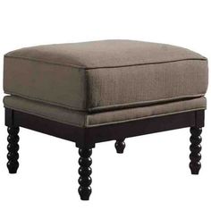 the foot stool is made from wood and has an ottoman cushion on top of it