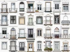 many windows and balconies are shown in different styles, sizes and colors on this white building