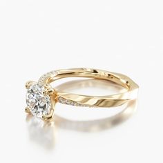 a yellow gold engagement ring set with a diamond