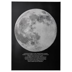 a black and white photo of the moon with an inscription on it's side