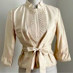 Gorgeous In Excellent Condition Size Medium Ladies 3/4 Sleeve 100% Silk With Beautiful Lace Up Bust Line And Light Ruffle Around Bottom And End Of Sleeve Spring Silk Stretch Top, Spring Beige Stretch Blouse, Beige Stretch Blouse For Spring, Stretch Beige Blouse For Spring, Spring Silk Stretch Blouse, Fitted Beige Top For Formal Occasions, Spring Formal Beige Tops, Formal Beige Tops For Spring, Formal Fitted Beige Top