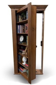 an open bookcase with books and clocks on the shelves in front of white background