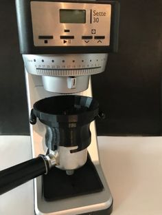 an espresso machine sitting on top of a counter