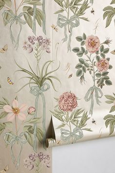 the wall paper has flowers and butterflies on it