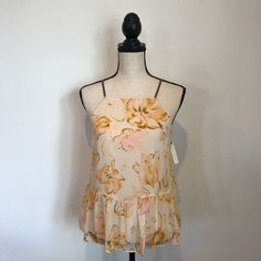 Beautiful Anthropologie Tank Top Blouse. Brand New With Tags. It Features A Beautiful And Dainty Strap Detail In The Back. Chic Spring Camisole Blouse, Chic Camisole Blouse For Day Out, Feminine Floral Print Camisole For Spring, Beige Floral Print Summer Tops, Feminine Spring Camisole For Brunch, Summer Beige Floral Print Tops, Feminine Camisole For Spring Brunch, Feminine Camisole For Brunch In Spring, Fitted Cami Blouse For The Beach