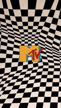 an image of a tv logo on a black and white checkerboard wallpaper