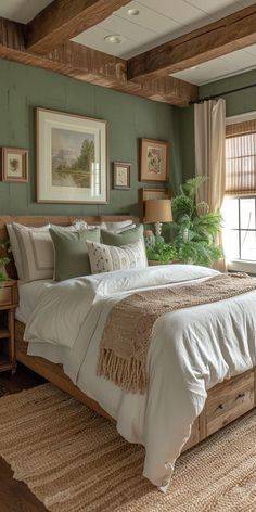 a bedroom with green walls and white bedding in the center, along with two windows