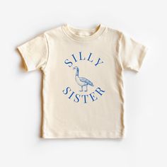 This Silly Sister graphic tee is 100% cotton, has a tear away tag for your child's comfort and comes in 4 natural Bella Canvas colors. In sizes 2T-5T, make this Silly Goose Sister Shirt the cutest birthday theme sibling shirt, big sister announcement shirt, or trendy everyday tee for your sister! DETAILS .100% Cotton .Bella Canvas tee .Tear away label .Runs true to size .Props in any photos are not included and are for styling purposes only .Colors may slightly vary from styled photos  SIZING This graphic tee design will be printed on a Bella Canvas shirt that is high quality, comfortable and so soft! Sizing runs true to size (please refer to the size chart for exact measurements). If you'd like a more oversized look I would recommend ordering a size up. If you prefer a tighter fit, size d Unisex Cotton Birthday Shirt, Cotton T-shirt With Funny Print For Birthday, Birthday Cotton Shirt With Text Print, Cotton Graphic Tee For Birthday, Birthday Graphic Tee In Cotton, Cotton Graphic Print T-shirt For Birthday, Birthday Graphic Cotton Tee, Birthday Graphic Print Cotton T-shirt, Cotton Graphic Print Shirt For Birthday