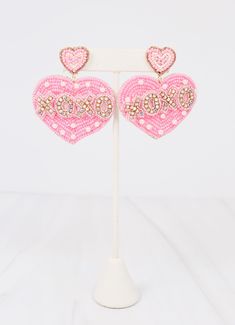 This beaded heart earring is so precious! It has 'XOXO' in rhinestones and accent pearls . It also has a beaded heart post as well. Dimensions: 2.5" long Beaded Heart, Heart Earring, Heart Earrings, Light Pink, Pink