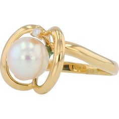 Experience the allure of timeless elegance with this exquisite 18K Yellow Gold Pearl Ring. At the heart of this masterpiece lies a luminous 7mm pearl, perfectly spherical and glowing with a rich, iridescent sheen that captures the light with every movement. The pearl is gracefully embraced by a contemporary swirl of 18K yellow gold, creating a harmonious blend of classic and modern aesthetics.Accentuating the pearl's natural beauty is a delicate diamond, weighing 0.015 carats, set seamlessly into the gold swirl. This sparkling gem adds just the right touch of brilliance, elevating the ring's sophistication. The design is both captivating and refined, making it a perfect choice for special occasions or as a cherished everyday piece.This ring is more than just jewelry; it is a symbol of love Sophisticated Jewelry, Gold Anniversary Rings, Gold Pearl Ring, Pearl And Diamond Ring, Diamond Birthstone, Birthday Ring, Yellow Gold Jewelry, Luxury Rings, 18k Yellow Gold Ring