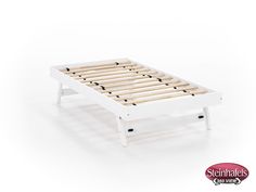 the bed frame is white and has wooden slats on each side, as well as black dots