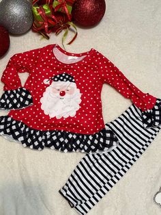 This Santa outfit is perfect for for any little one🎄 Oh how cute this Santa outfitt for any Christmas party ,and family pictures. Your little one will be adorable in this Santa outfit   This outfit comes with  Santa ruffle shirt an striped pants sizes available 12/18-5/6 Material is 95% cotton and 5% spandex in soft milk silk material.  They are very comfortable, stretchy, and very soft. Santa Outfit Kids, Cute Winter Sets With Ruffles, Festive Family Matching Sets For Holidays, Family Matching Sets For Festive Holiday Season, Cute Cotton Holiday Sets, Cute Cotton Sets For Holidays, Cute Fitted Christmas Sets, Cute Festive Winter Sets, Fitted Cotton Christmas Sets