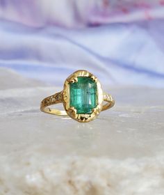 * guided by love* _________ ONE OF A KIND Can be sized from 4 - 7. Please put your desired size in notes section 18k Yellow Gold Set w/ 1.53 ct Zambian Emerald approx 8.3 x 5.77 mm (6) 1.3mm White Diamonds Accent stones on (3) on each side of diamonds. *Emeralds *The presence of inclusion and imperfections are natural and add to their character, which so many people are drawn to. Unique Yellow Gold Emerald Ring With Accent Stones, Luxury Vvs Clarity Emerald Ring As A Gift, Luxury Vvs Clarity Emerald Ring Gift, Unique Emerald Ring With Center Stone As Gift, Luxury Emerald Gemstone Ring For Promise, Luxury Emerald Rings As Gift, Luxury Emerald Ring As Gift, Timeless Emerald Ring With Accent Stones As Gift, Diamond Rings With Certificate Of Authenticity For Gift