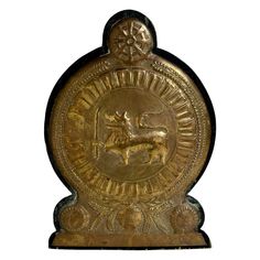 an ornate gold plaque with a horse on it