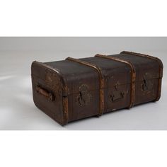 three old suitcases sitting side by side on a white surface