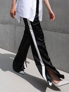 Midweight satin track trouser pants with side stripe in contract color. Straight leg with slight flare at bottom. Model is in MINUSEY S. ✔️ Free worldwide express shipping over $100✔️ Loved by 6,500+ customers✔️ Limited edition collections, maximum style⠀⠀⠀⠀⠀⠀⠀⠀⠀Stay ahead of the trend with can’t-find-anywhere-else staples. Your closet will thank you 💕* MINUSEY S = EU 34, US 2* MINUSEY M = EU 36, US 4* 100% Polyester* Dry clean* Made in Korea - Model Height: 172cm/5'7" (US2, EU34) Black Satin Wide-leg Pants, Black Full-length Satin Pants, Black Full Length Satin Pants, Black Satin Full-length Pants, Full Length Pants With Side Stripes, Pants With Side Stripe, Black Sweatpants Outfit, Sweatpants Outfit, Stripe Outfits