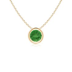 The round tsavorite appears to be floating on the chain. It is secured in a 14k yellow gold bezel setting and charms with its bright green hue. This solitaire pendant is simple and alluring. Classic Green Emerald Necklace With Bezel Setting, Classic Green Jewelry With Smooth Bezel, Green Gemstone Birthstone Necklace With Round Pendant, Green Gemstone Round Pendant Birthstone Necklace, Green Necklace With Bezel Setting For May Birthstone, Green Birthstone Necklaces, Green Birthstone Necklace With Round Pendant, Green Round Gemstone Birthstone Necklace, Green Gemstone Round Birthstone Necklace