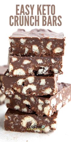 easy keto crunch bars stacked on top of each other with chocolate and marshmallows