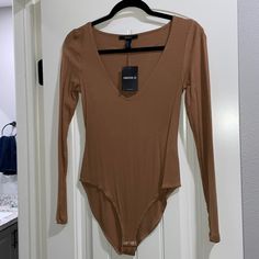 Forever 21 Nwt Brown Long Sleeve Bodysuit Casual Long Sleeve Bodysuit For Date Night, Casual Brown Bodysuit For Spring, Trendy Brown Bodysuit For Spring, Trendy Brown Bodysuit For Night Out, Forever 21 Long Sleeve Bodysuit For Spring, Forever 21 Long Sleeve Stretch Bodysuit, Forever 21 Stretch Long Sleeve Bodysuit, Forever 21 Casual Bodysuit For Night Out, Fitted Brown Bodysuit For Spring