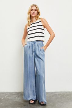 Model is wearing Denim Wide Leg Pants with a white black striped top and black sandals Casual Dark Wash Wide-leg Jeans, Wide Leg Tencel Pants With Pockets, Casual Dark Wash Tencel Jeans, Casual Medium Wash Wide-leg Cropped Jeans, Relaxed Fit Wide-leg Cropped Jeans With Five Pockets, Denim Blue Tencel Straight Leg Bottoms, Light Wash Wide Leg Flare Jeans For Work, Casual Dark Wash Wide-leg Cropped Jeans, Wide Leg Light Wash Flare Jeans For Work