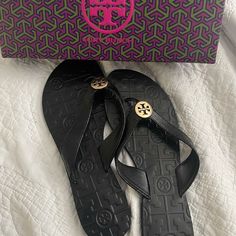 Brand New! Tory Burch Sandals Luxury Black Leather Flip Flops, Designer Black Flip Flops For The Beach, Designer Black Flip Flops For Beach, Tan Wedge Sandals, Ribbon Flats, Jelly Flip Flops, Tory Burch Flip Flops, Printed Flip Flops, Tory Burch Sandals